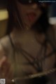 A blurry image of a woman with her mouth open.